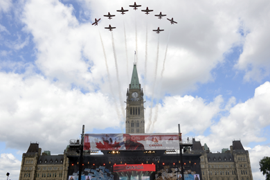 The Canadian Forces Snowbirds Demonstration Team conducts a fly-past above Parliament Hill as part of Canada Day celebrations in Ottawa