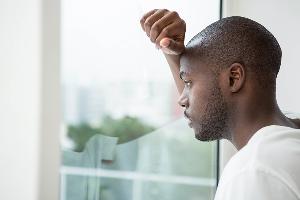 man staring out the window